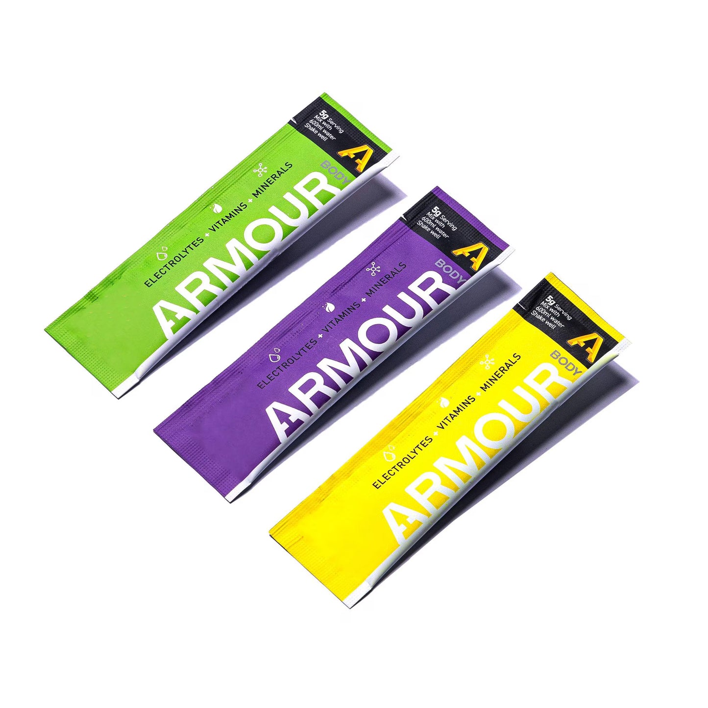 Three Armour packets in green, purple, and yellow on a white background